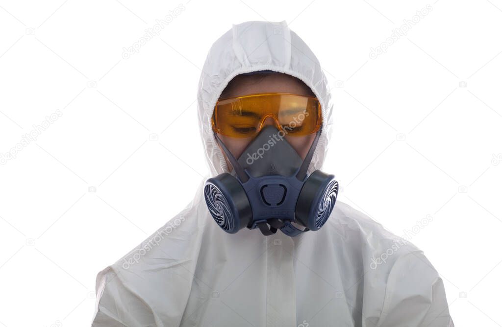 Woman in a white chemical protective clothing and antigas mask with yellow glasses at white background, Women scientist in safety suit, Safety virus infection concept, pollution protect face masking, breathing masks