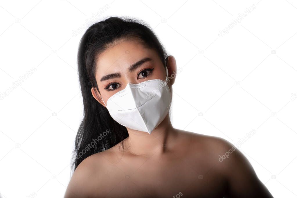 Close up of a woman putting on a respirator N95 mask to protect from airborne respiratory diseases as the flu covid-19 coronavirus ebola PM2.5 dust and smog, Safety virus infection concept, 