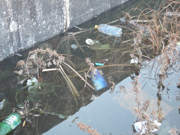 plastic garbage dump in the pond. Russia, Saratov-November 2019