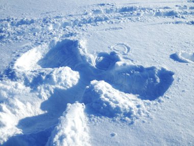 Big picture of the snow angel on clean snow clipart