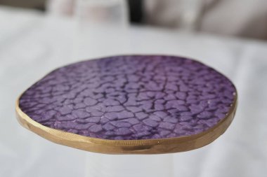 Epoxy resin coasters. purple gold. Epoxy resin art. clipart