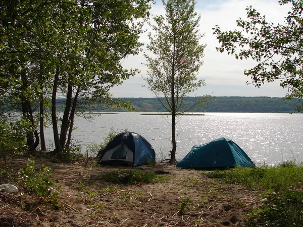 Camping tent in a camping on the river bank.