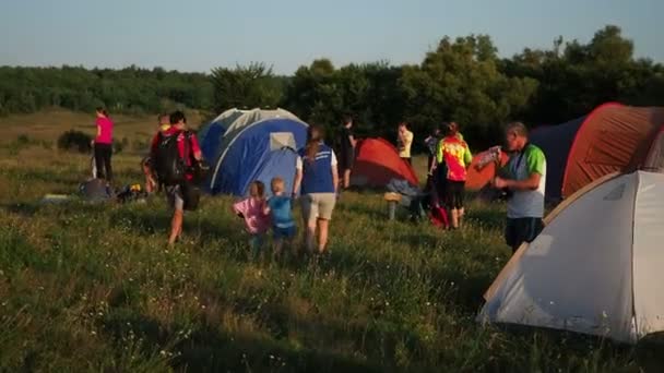 Camping and tent in nature sunset. several families are vacationing and doing ecotourism. Russia, Saratov region - august, 2018 — Stock Video