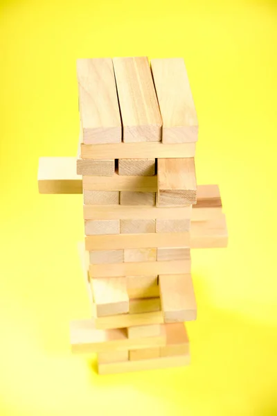 Bloky Dřevěné Hry Jenga Žlutém Pozadí — Stock fotografie