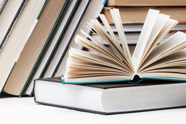 Books stacked glasses on the table