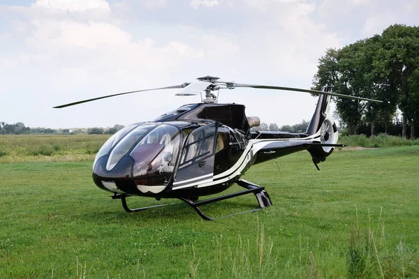 The Eurocopter EC 120B Colibri helicopter standing at the airpor — Stock Photo, Image