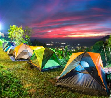 Camping and tent on top of mountain at sunset time clipart