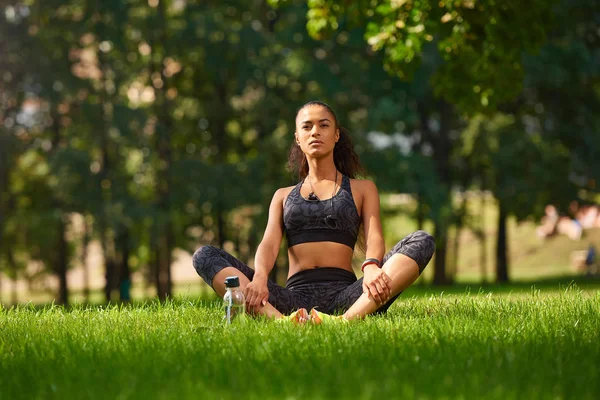 Woman Yoga  - relax in nature concept in park