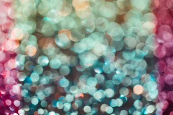 Feestelijke multicolor en blauwe glitters achtergrond met bokeh en licht lek effect — Stockfoto