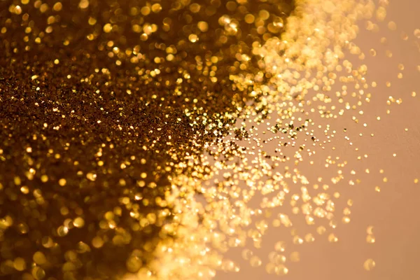 Altından parıltılı bokeh dokusu metin için: noel, kutlama, parti, davetiye soyut arkaplan