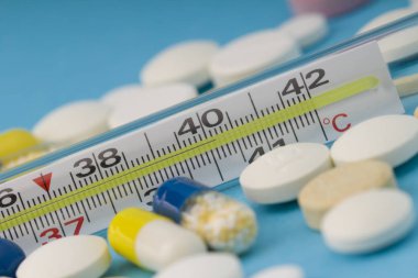 Mercury thermometer  with a temperature of 40 degrees and medici