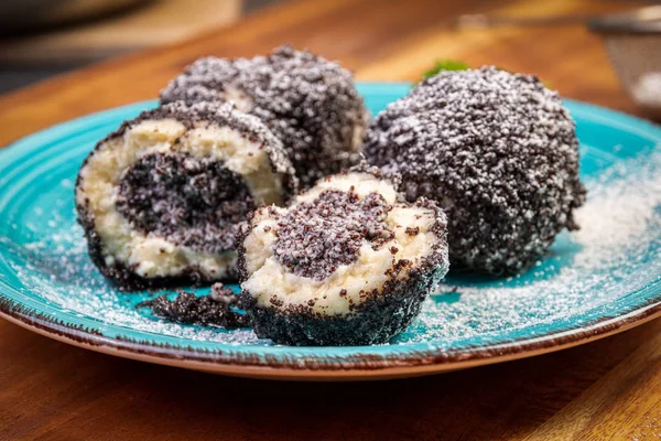 sweet dumplings with poppy seeds and icing sugar