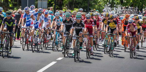 Bormio, Italy May 23, 2017: A Gorup of Professional Cyclists passes the center of Bormio before going up to the top of the Stelvio in the hardest montain stage of Tour of Italy 2017.