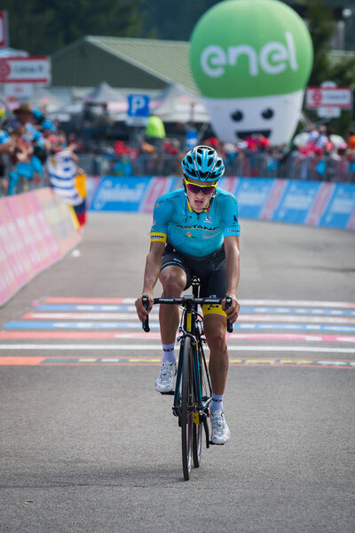 Piancavallo, Italy May 26, 2017: Professional Cyclist exhausted passes the finish line after a hard montain stage of Tour of Italy 2017  with an uphill finish in Piancavallo.