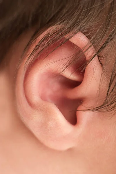 Ear and hair of the newborn baby, macro, close up, maternal care, love and family hugs, tenderness — Stock Photo, Image