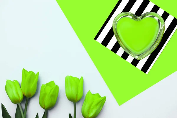 Neon green heart and yellow tulips on a green stripes background, mock up, valentines day concept, — Stock Photo, Image