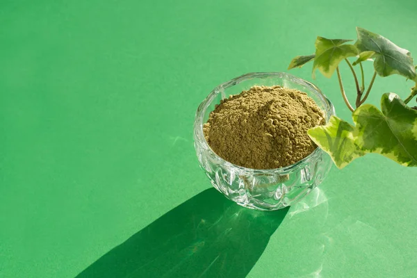 matcha dry green powder on a pink background for making Japanese natural tea.