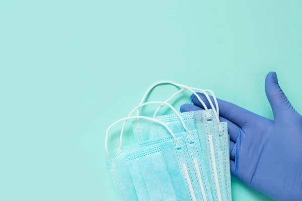 Prevent coronavirus. Medical mask, Medical protective mask isolated on blue background. Coronavirus hygiene concept