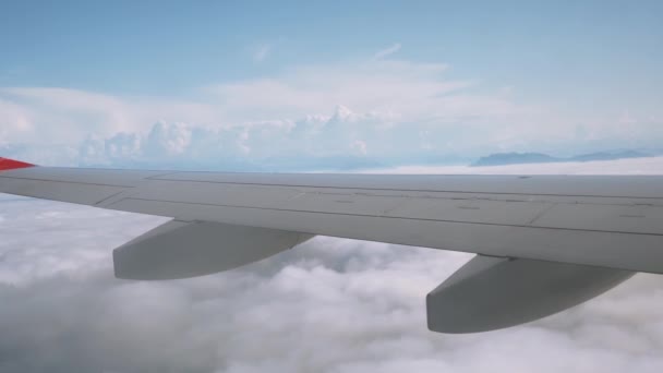 View from the plane through the window to incredibly beautiful clouds and sky 4K — Stock Video