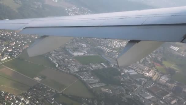 Flight by plane over the city. View from the window of the airplane. Ultra HD — Stock Video