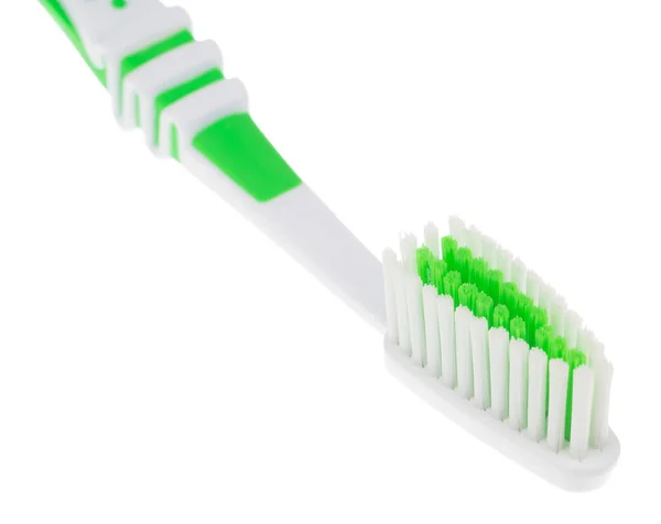 Зеленая зубная щетка на белом — стоковое фото