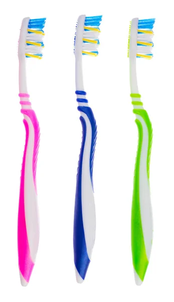 Three toothbrushes on white — Stock Photo, Image