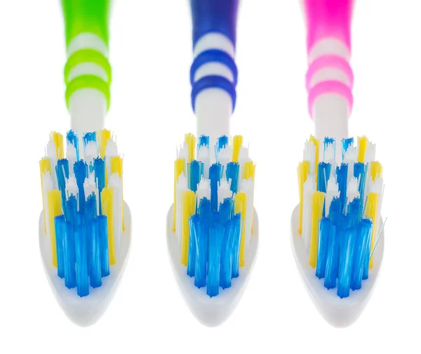 Three toothbrushes isolated — Stock Photo, Image