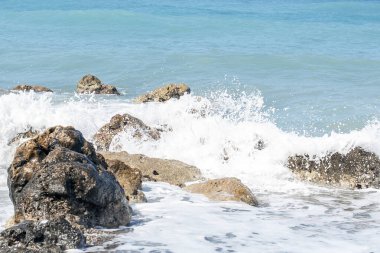 beautiful waves beat against the rocks, water surface as a background.