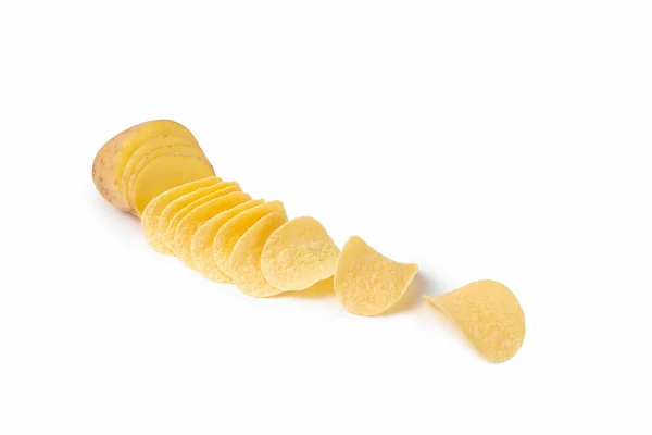 Creative photography. Sliced potatoes and chips on a white isolated background. The idea is how potatoes turn into chips. — Stock Photo, Image