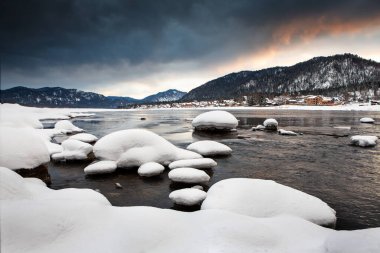 The beginning of spring. Dawn on the river. Change of seasons. Melting snow.