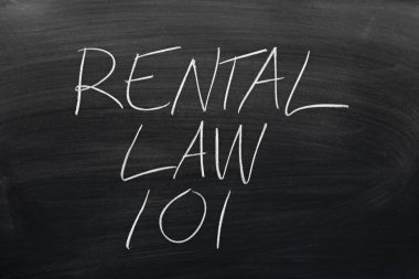 Rental Law 101 On A Blackboard clipart