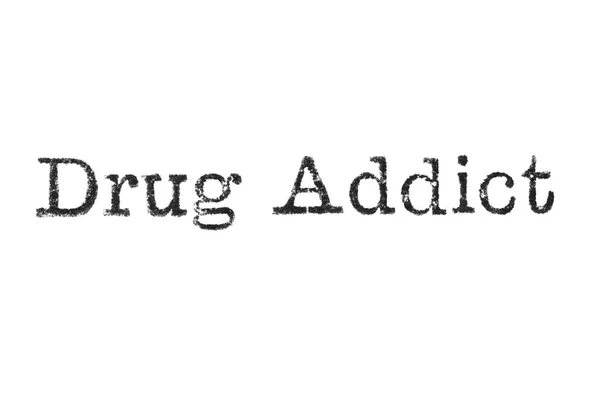 Ordet "Drug Addict" från en skrivmaskin på vit — Stockfoto