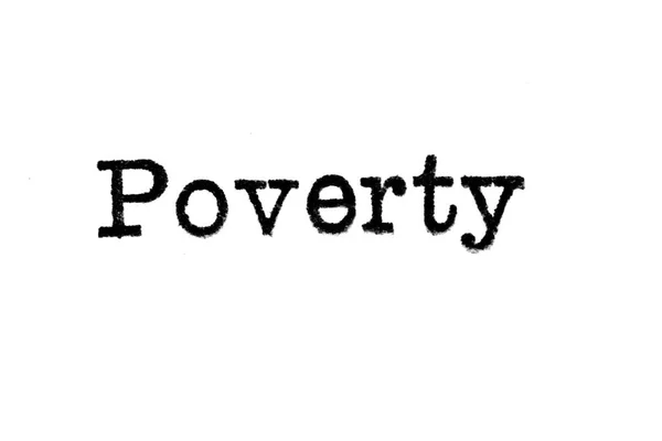 Η λέξη «Φτώχεια» από μια γραφομηχανή σε λευκό — Φωτογραφία Αρχείου