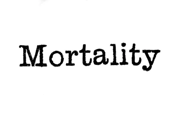 The word "Mortality" from a typewriter on white — Stock Photo, Image