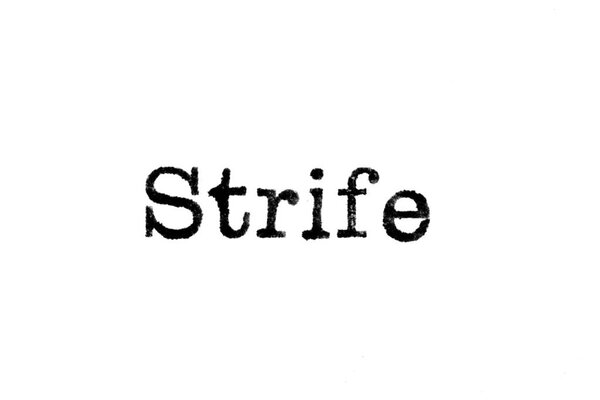 The word "Strife" from a typewriter on white