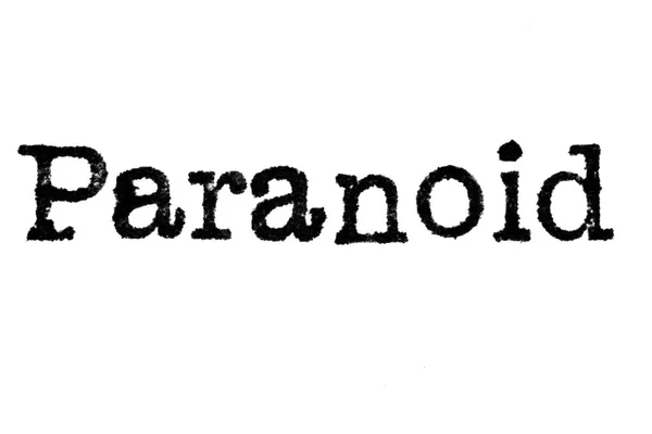 Le mot "paranoïaque" d'une machine à écrire sur blanc — Photo