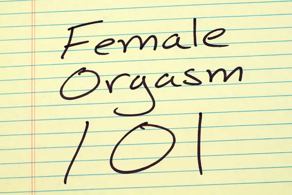 Orgasmo femenino 101 en una almohadilla legal amarilla —  Fotos de Stock