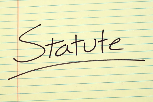 Statute On A Yellow Legal Pad — Stock Photo, Image