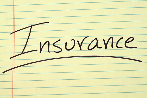 Insurance On A Yellow Legal Pad — Stock Photo, Image