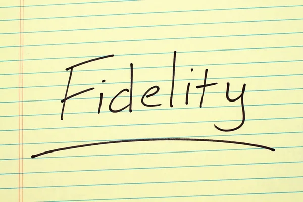 Fidelity On A Yellow Legal Pad — Stock Photo, Image