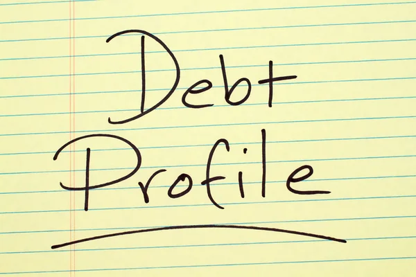 Adósság egy sárga jogi Pad-profiljához — Stock Fotó