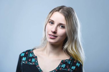 Closeup portrait of a girl, on an isolated gray background. Human face expression, emotions, feeling attitude reaction