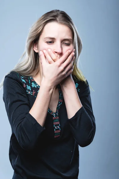 Closeup portrait of a girl, on an isolated gray background. Human face expression, emotions, feeling attitude reaction — Stock Fotó