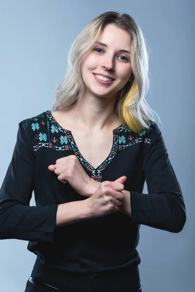 Closeup portrait of a girl, on an isolated gray background. Human face expression, emotions, feeling attitude reaction — Stock Fotó