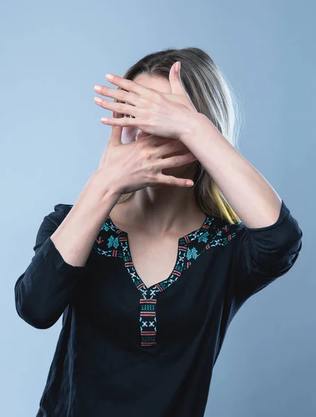 Closeup portrait of a girl, on an isolated gray background. Human face expression, emotions, feeling attitude reaction — Stock Fotó