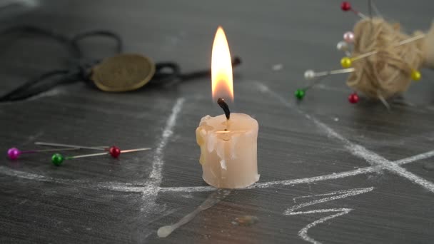 A candle melts on a table with an occult circle. Timelapse. — Stock Video