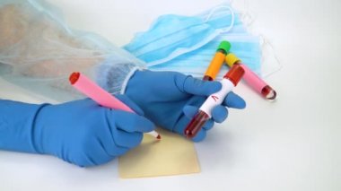 Hand holding blood sample in vacuum tube. Positive test result for the rapidly spreading Coronavirus, originating in Wuhan, China. New type virus 2019-n CoV. MERS chinese infection, atypical pneumonia