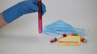 Hand holding blood sample in vacuum tube. Positive test result for the rapidly spreading Coronavirus, originating in Wuhan, China. New type virus 2019-n CoV. MERS chinese infection, atypical pneumonia