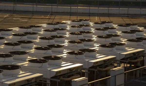 many large industrial air conditioner. compressor machine part of air conditioner system. Industrial air conditioner condensers (outside unit) on the roof of a building on a hot summer day.