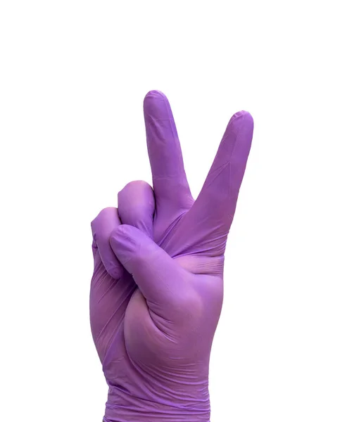 Ręka z rękawicą medyczną wykonując gest Zwycięstwa, symbolizujący zwycięstwo nad COVID-19. — Zdjęcie stockowe